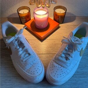 Women’s Nike white and gold sneakers